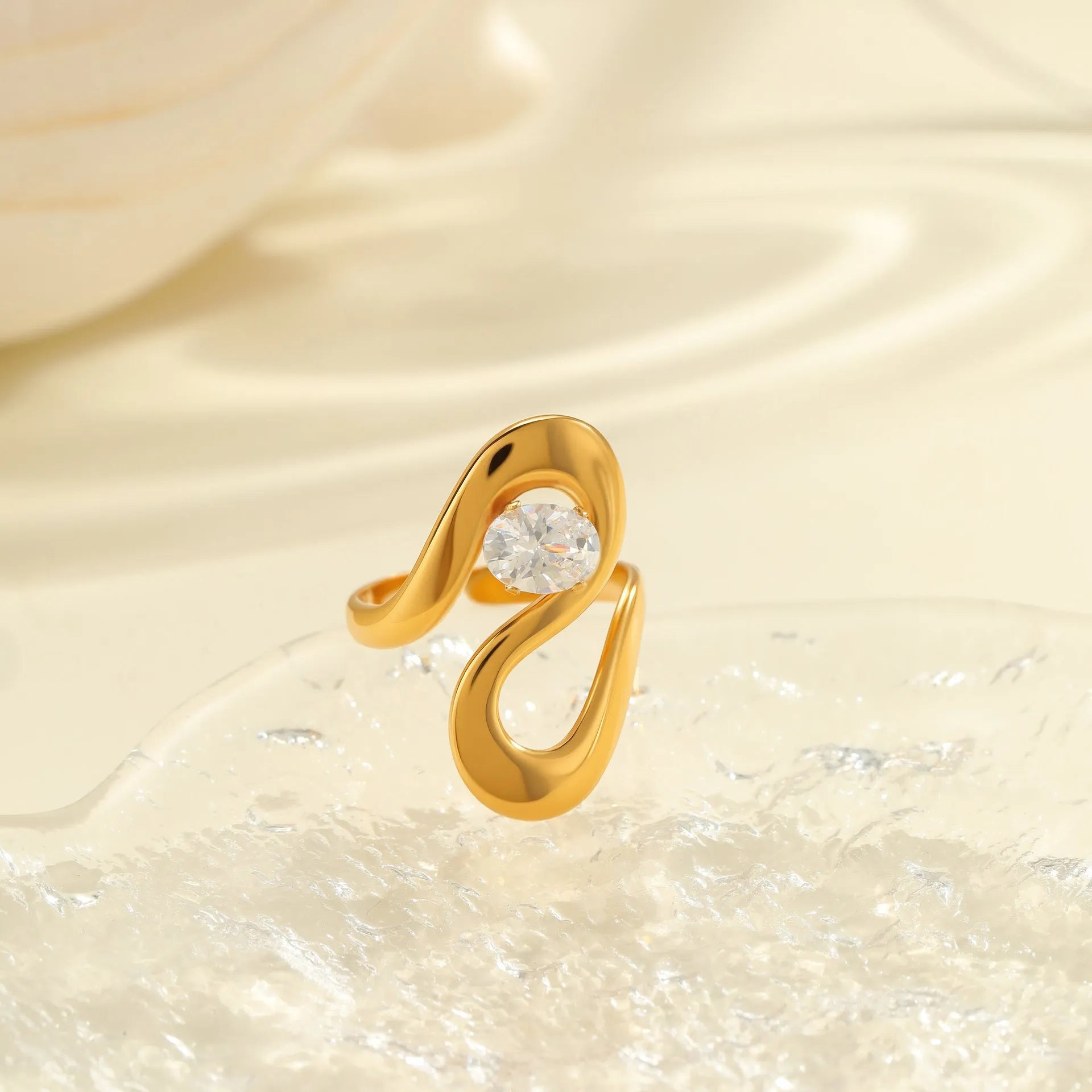Geometric open mouth zircon ring in stainless steel with electroplated colour finish.