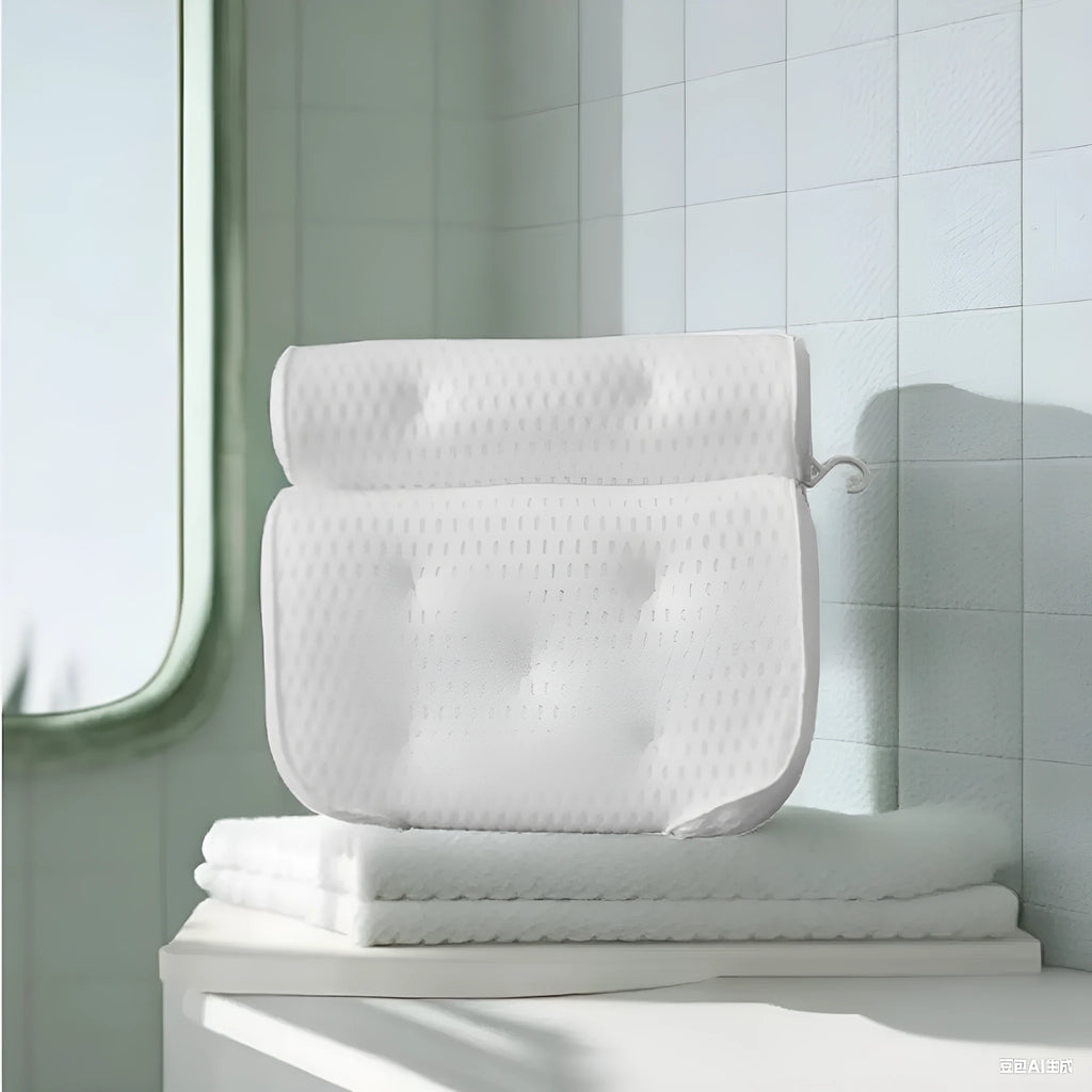 White bathtub pillow with mesh fabric and seven large suction cups on the back.