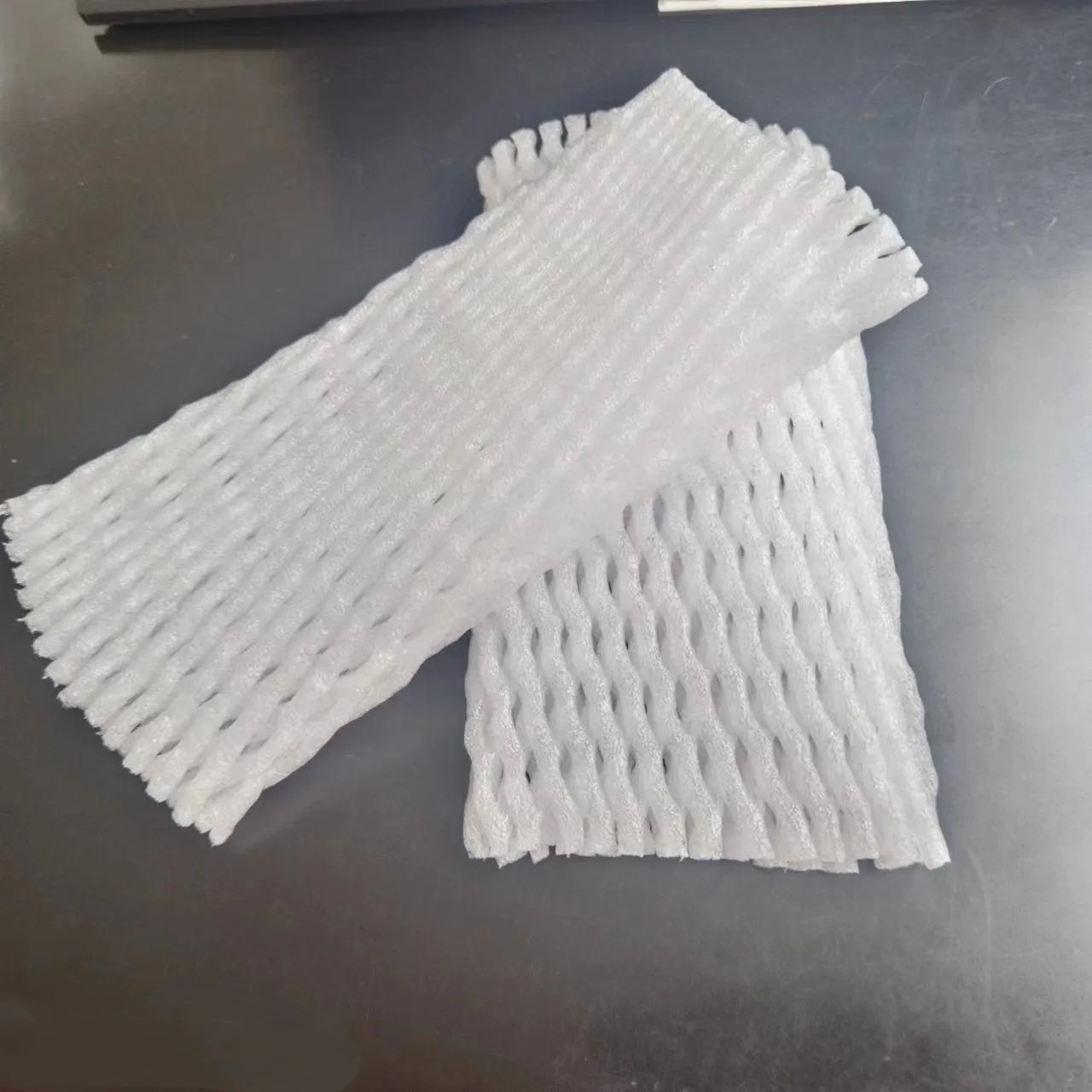 White foam protective net cover pack showing multiple size options for packaging protection