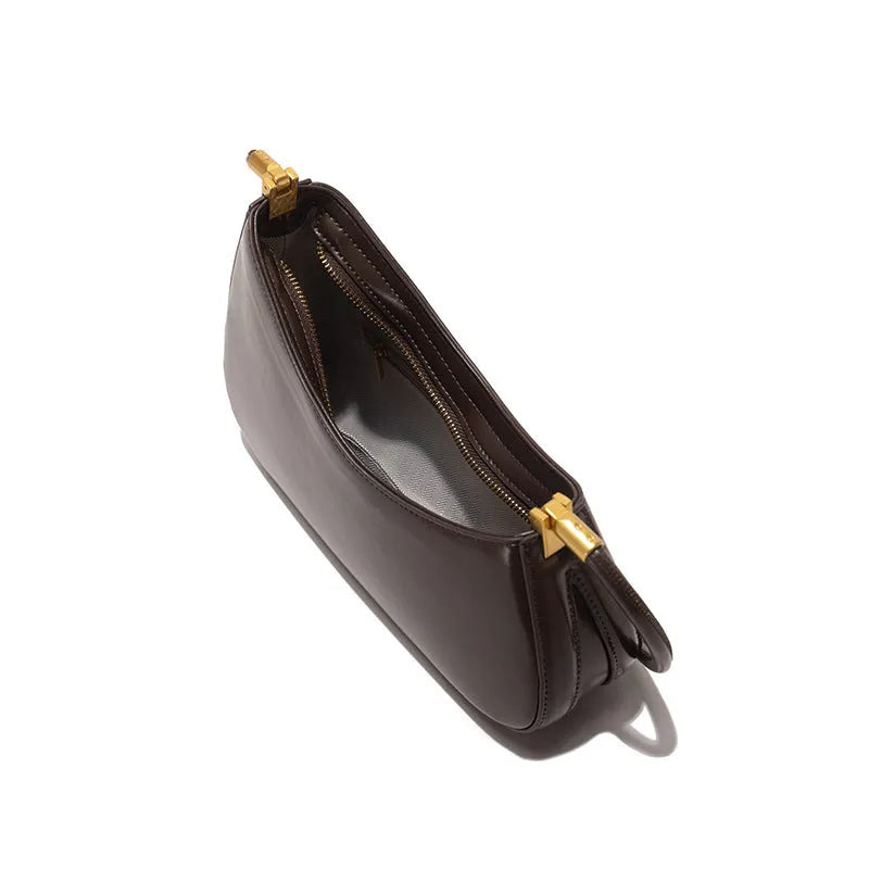 Retro oval women's underarm bag in seven colour options with single shoulder strap and sandwich pocket