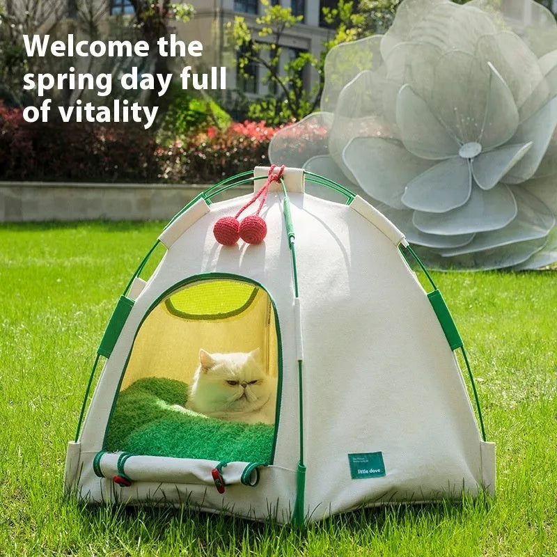 Grey dome-shaped cloth pet tent with a thick padded base for a cat.