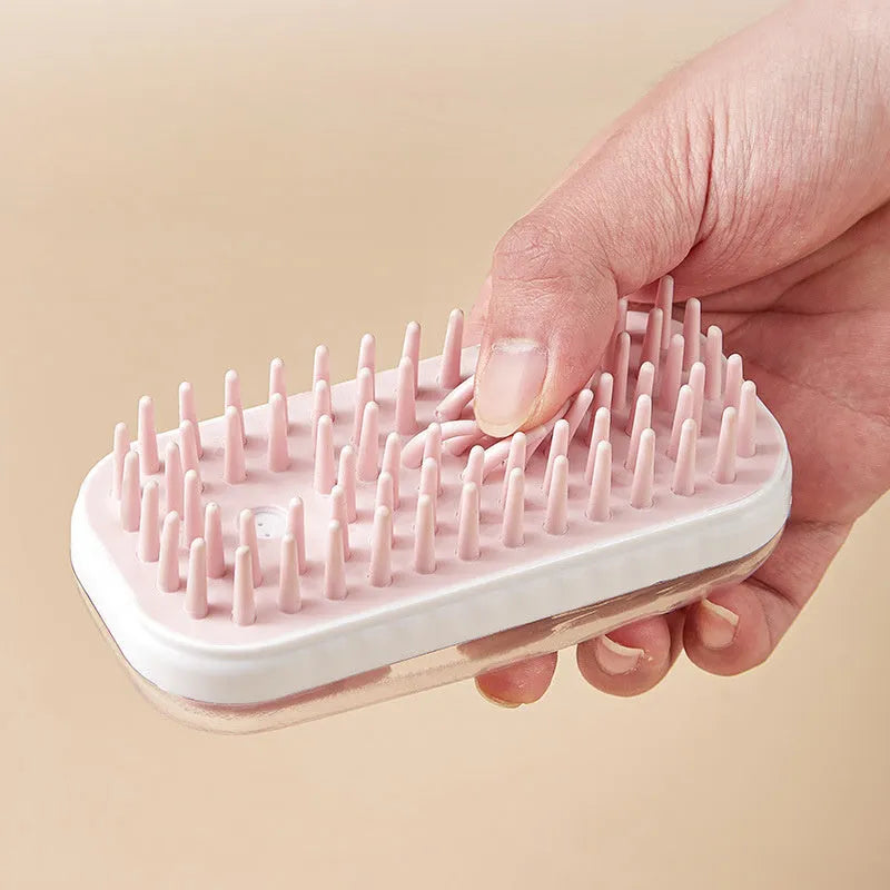 Grey silicone bath brush for pets with soft-tipped bristles and ergonomic handle