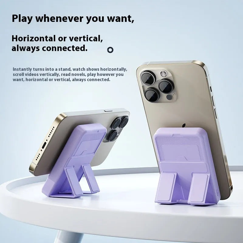 Magnetic wireless power bank with bracket in white, showing 10000mAh capacity and USB port, on a desk