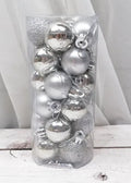 Assortment of 3cm diameter shiny and matte Christmas decoration balls in red, gold, blue, and silver colours.