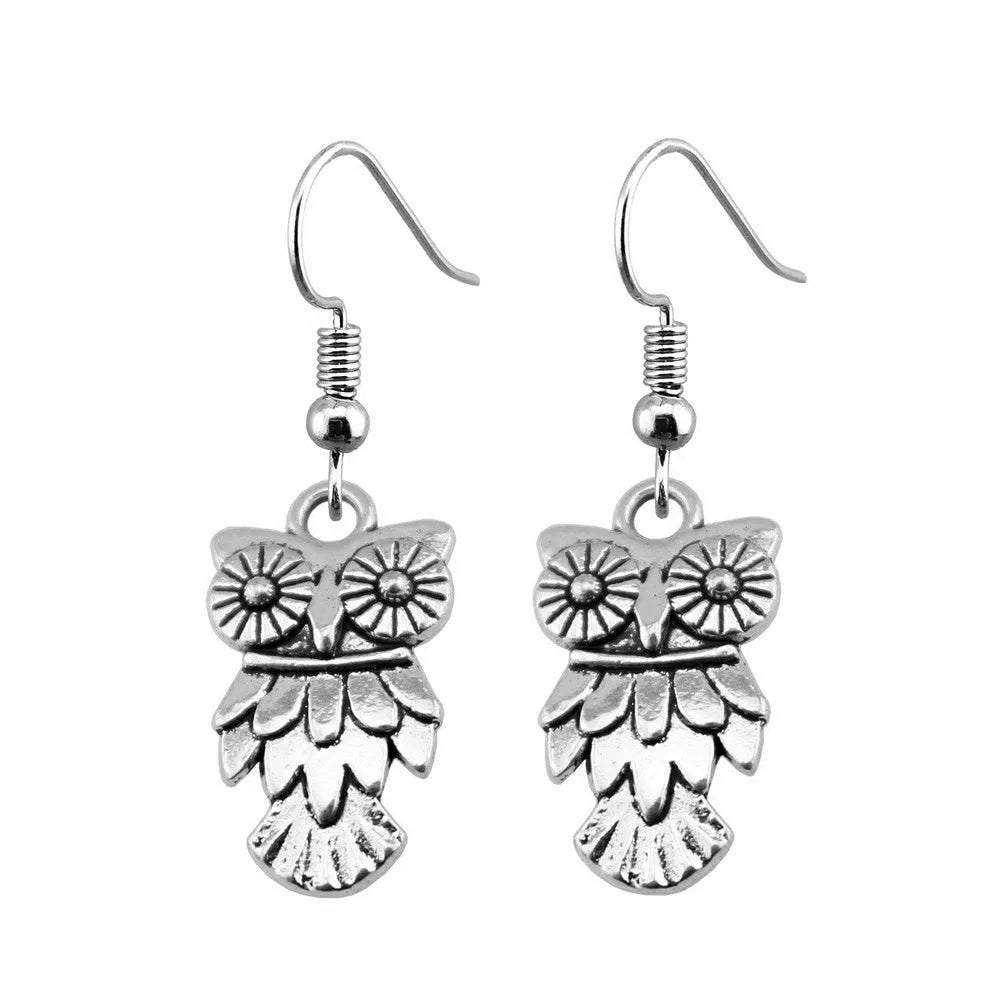 Retro minimalist handmade owl drop earrings in Antique Silver metal finish on a light background