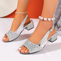 Gold open toe sandals with a buckle fastening and fish mouth toe design on a rubber sole.