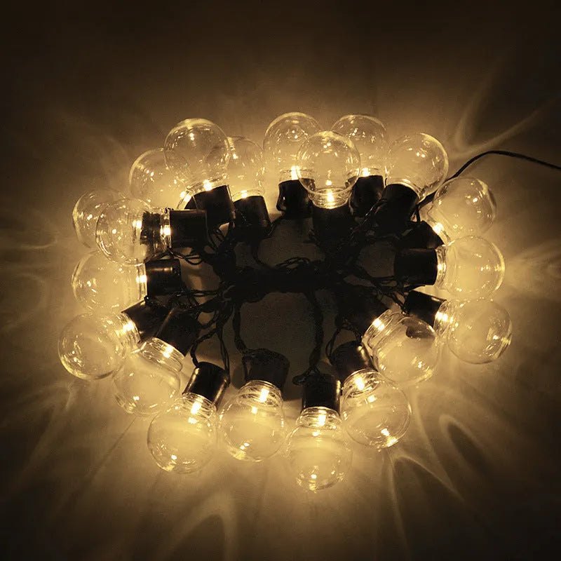 10-metre solar-powered festival string lights with 40 warm white bulbs on black cable for outdoor tent lighting