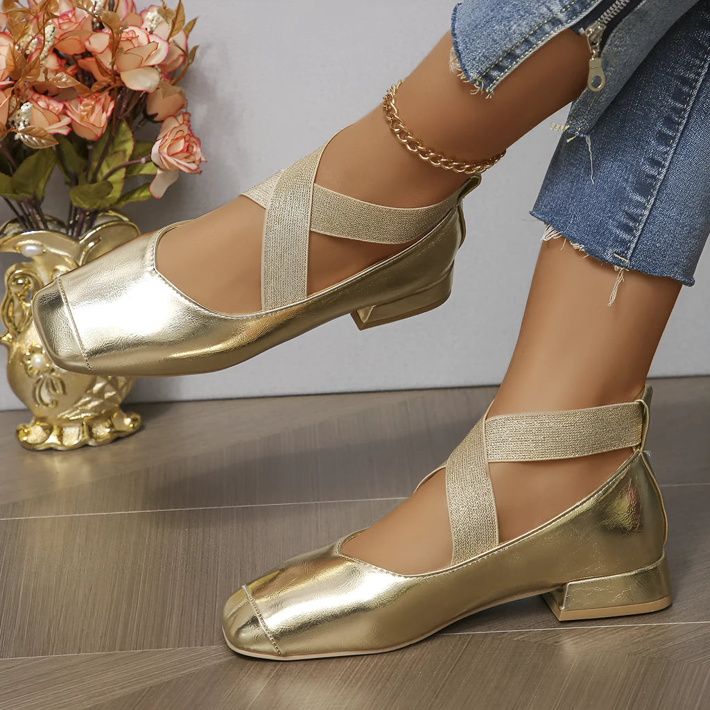 Gold slip-on overshoes with a square toe and low rubber heel, shown as shoe covers.