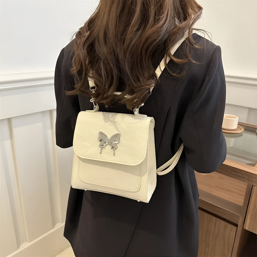 Women's preppy style PU backpack handbag with bow detail in light blue colour
