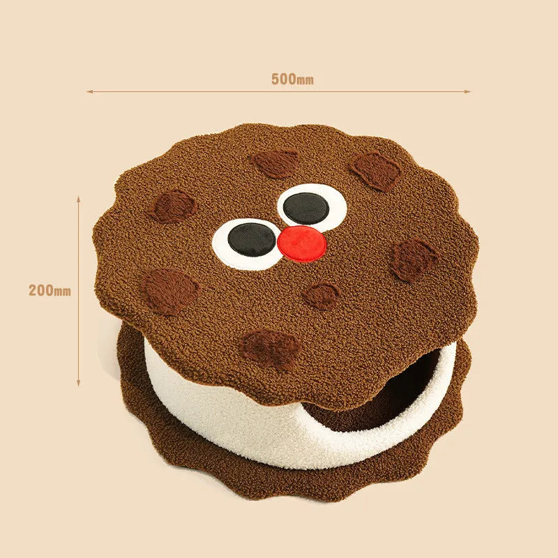 Khaki-coloured closed cat house with a nest shape resembling a sandwich cookie.