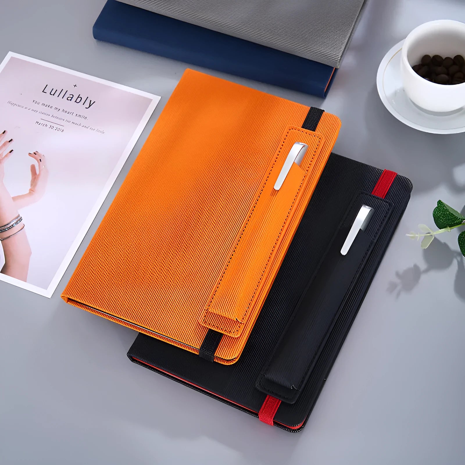 A5 faux leather notebook open with pen insert and strap, 200 pages, blue and black options