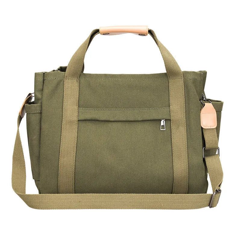 Canvas tote bag with internal organisation pockets for phone, documents, laptop, and camera in horizontal square shape