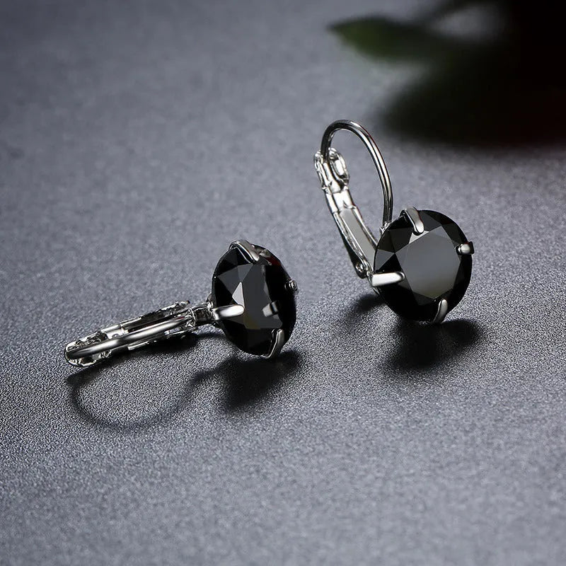 Single zircon ear clip in brass with AA zircon stone rhinestone inlay geometric shape, available in multiple colours