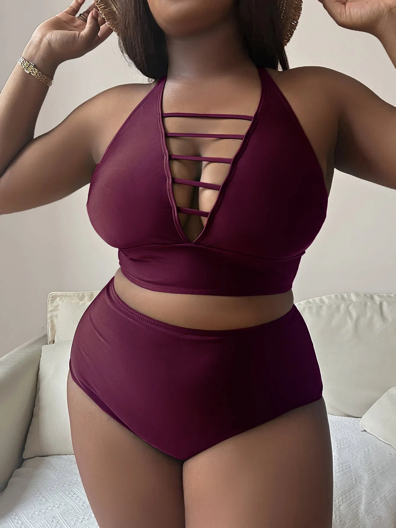 Plus size black halter bikini with cross back straps and high waist briefs on mannequin