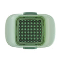 Green manual vegetable chopper with stainless steel blades for onions and potatoes.