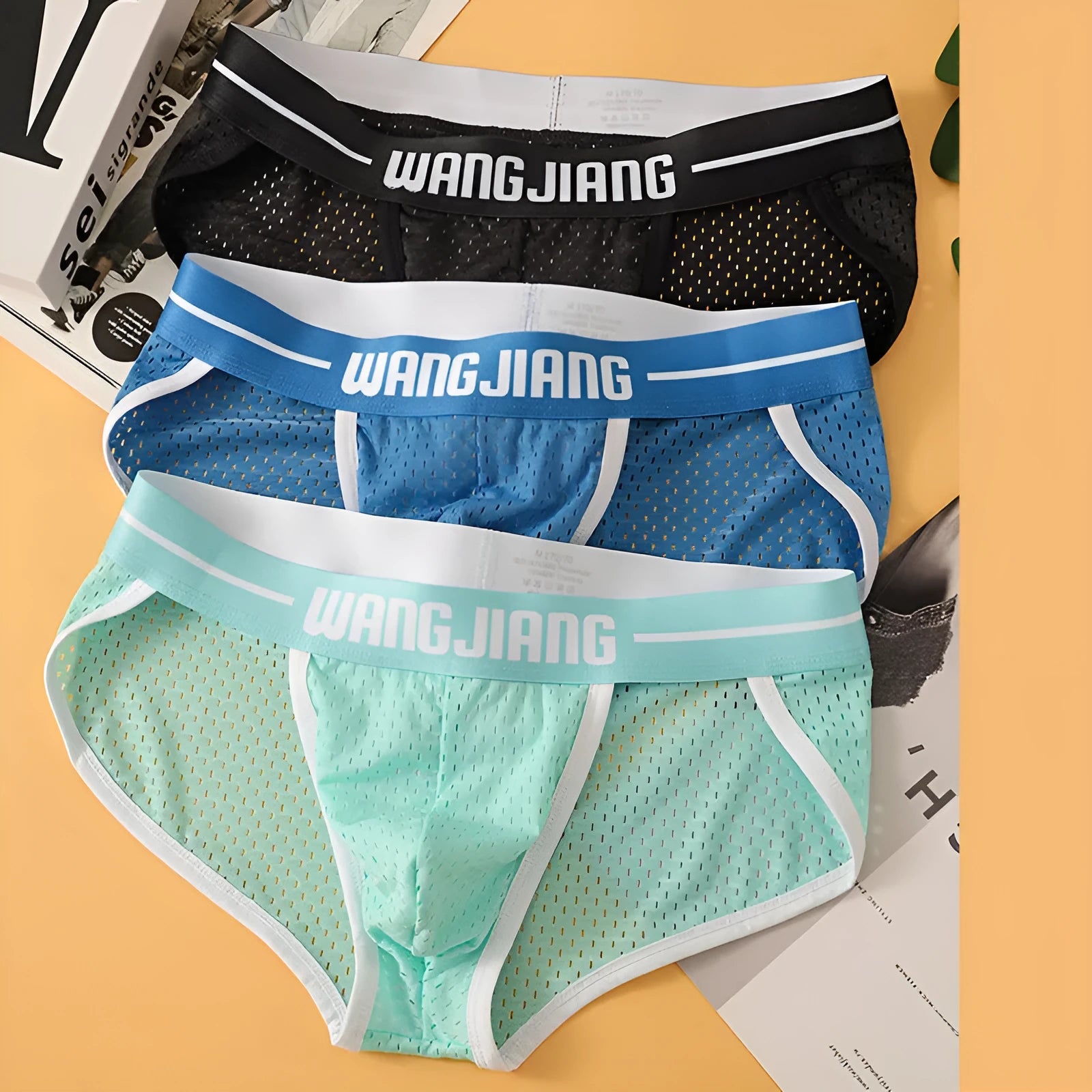 Men's ice silk triangle underwear with mesh panels in black, white, grey, blue, pink, and light green
