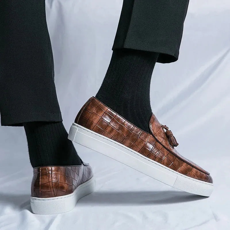 Men's brown artificial PU sneakers with a tassel detail and round toe on a rubber sole.