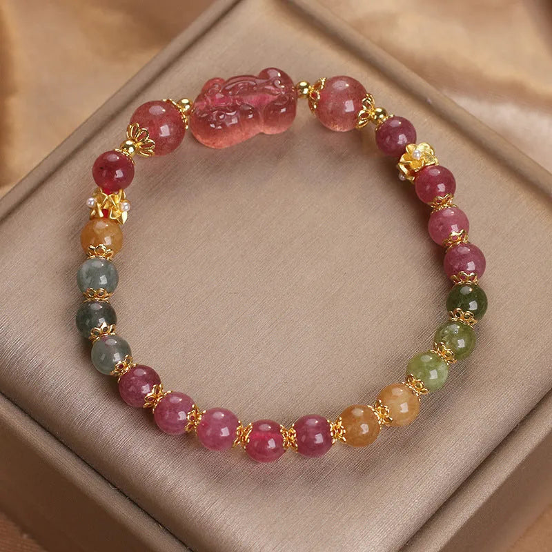Pink and red candy colour crystal bracelet with tourmaline and strawberry quartz stones, 17 cm length.