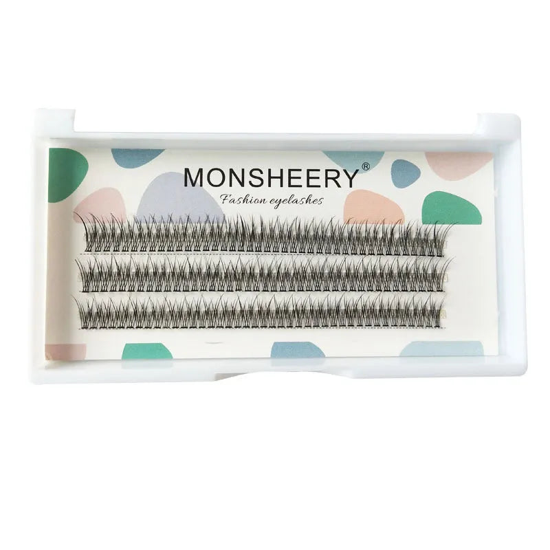 Black V-shaped fairy fishtail false eyelashes with thick segments in varying lengths on a clear band.
