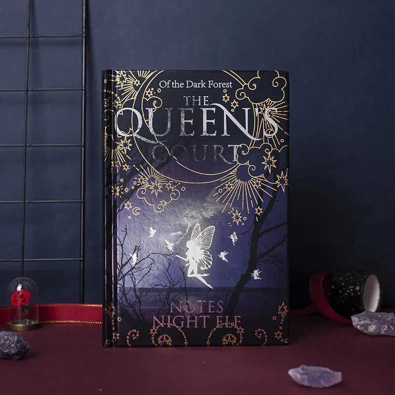 Blue and purple luminous hardcover A5 notebooks open to show full-colour illustrated pages.