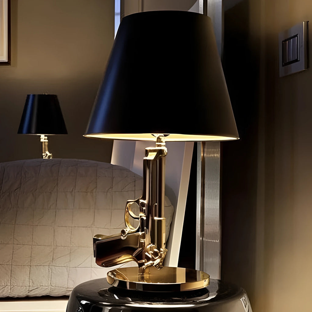 Creative resin desk lamp with plated gold pistol shape on a desk, 235x425mm, Nordic style