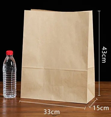 Yellow thickened kraft paper inner packaging bag with aluminium foil lining for snacks.
