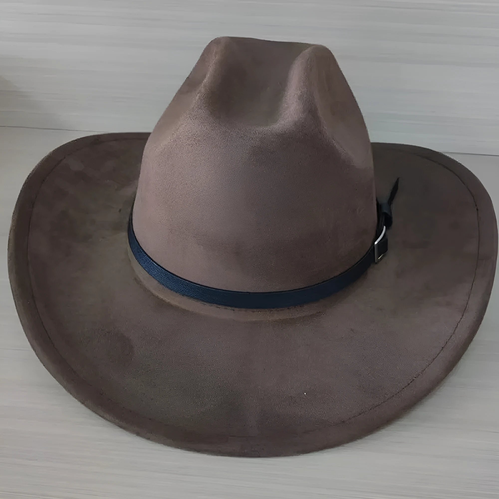 Brown leather velvet cowboy hat with curved edge and conical crown Western style