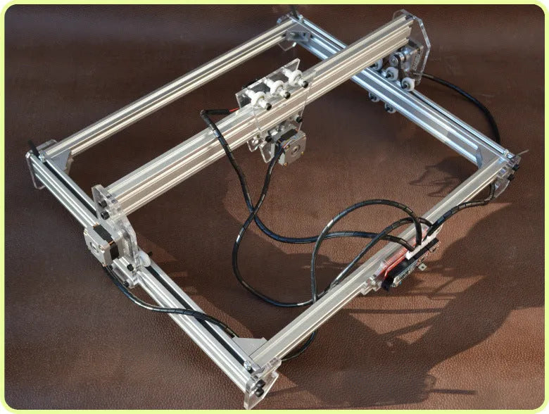 Miniature 3000mW laser engraving machine with a 400x300mm base plate for desktop marking.