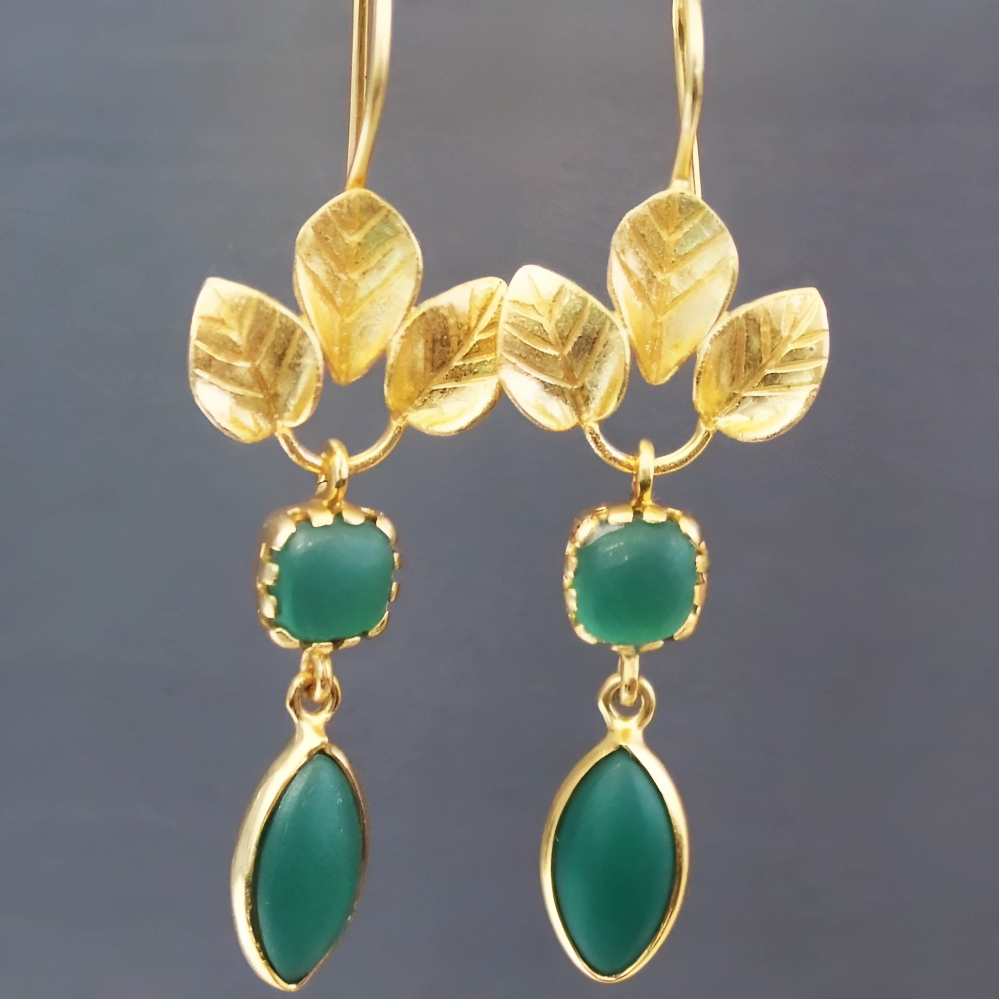 Gold retro water drop earrings with French leaves and tassel details on a delicate copper drop shape.