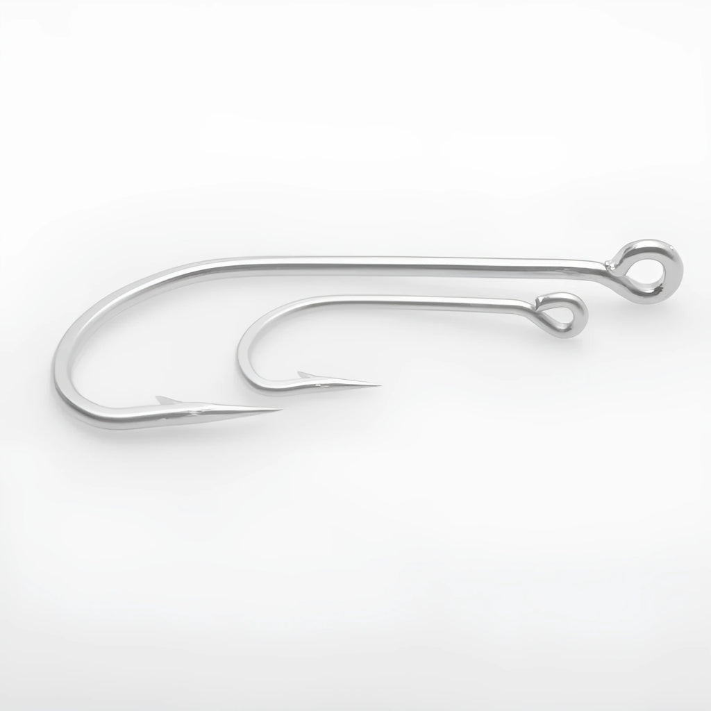 Assortment of alloy sea fishing hooks on a blue background for ocean boat fishing.