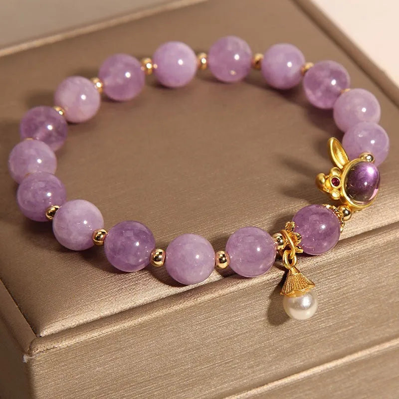 Purplish red jade rabbit hare head charm on a crystal Mori style bracelet.