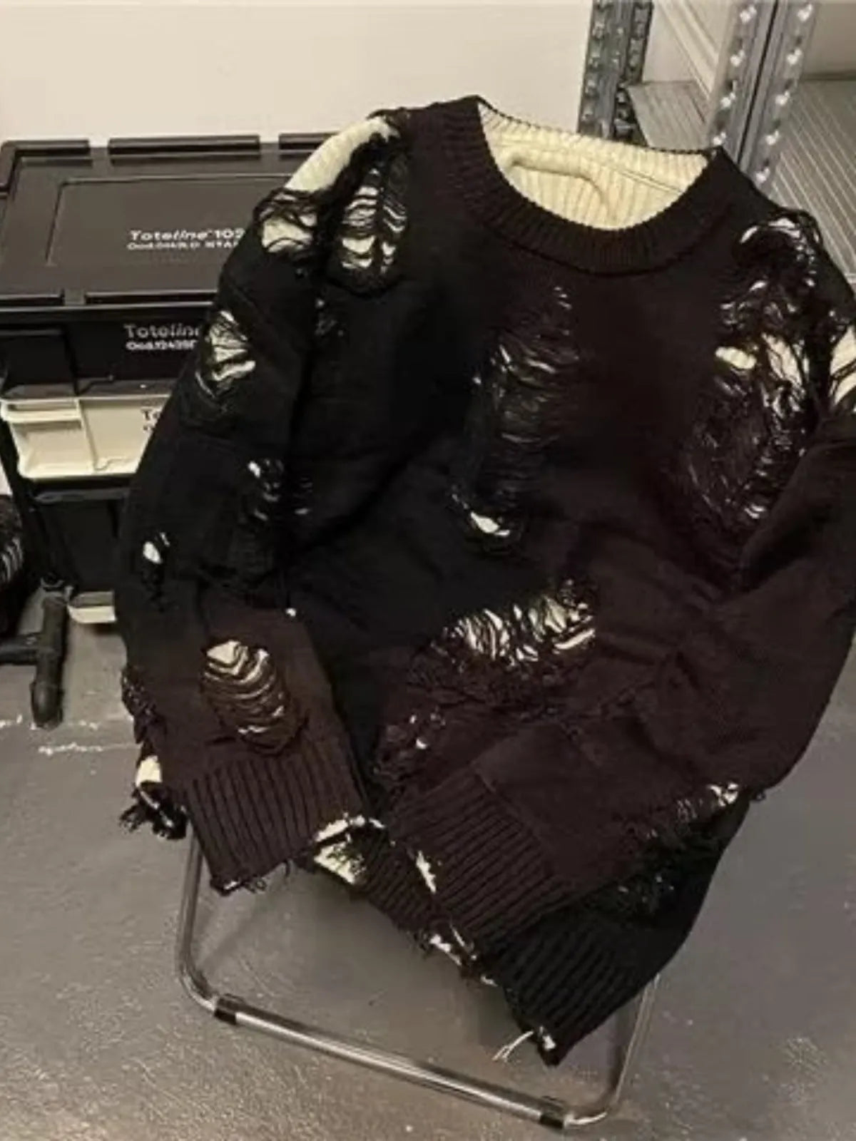 Men's ripped pullover sweater in black or grey with animal pattern, tassel detail and princess sleeves