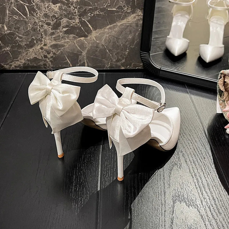Satin white wedding shoes plus size with ankle buckle closure and 7cm heel on white background