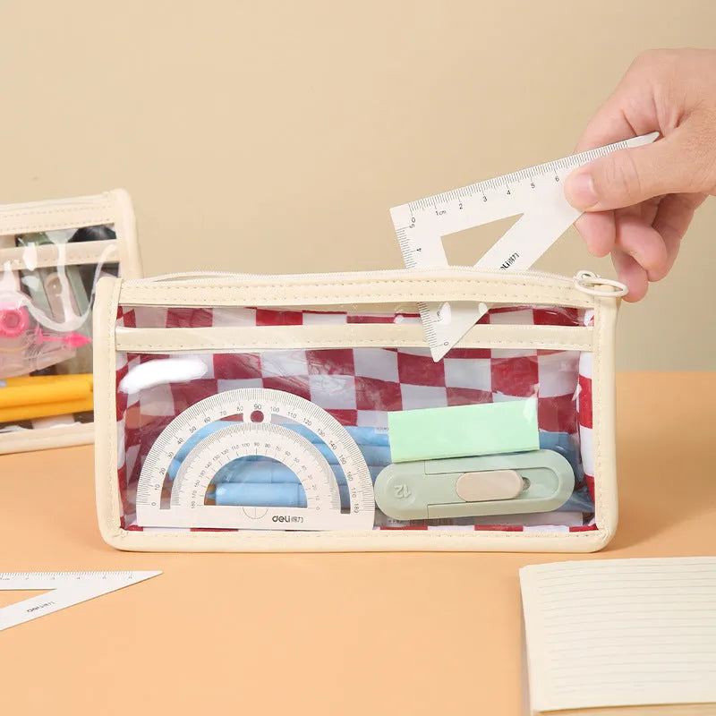 Large transparent PVC pencil case with internal black and white chessboard grid design.