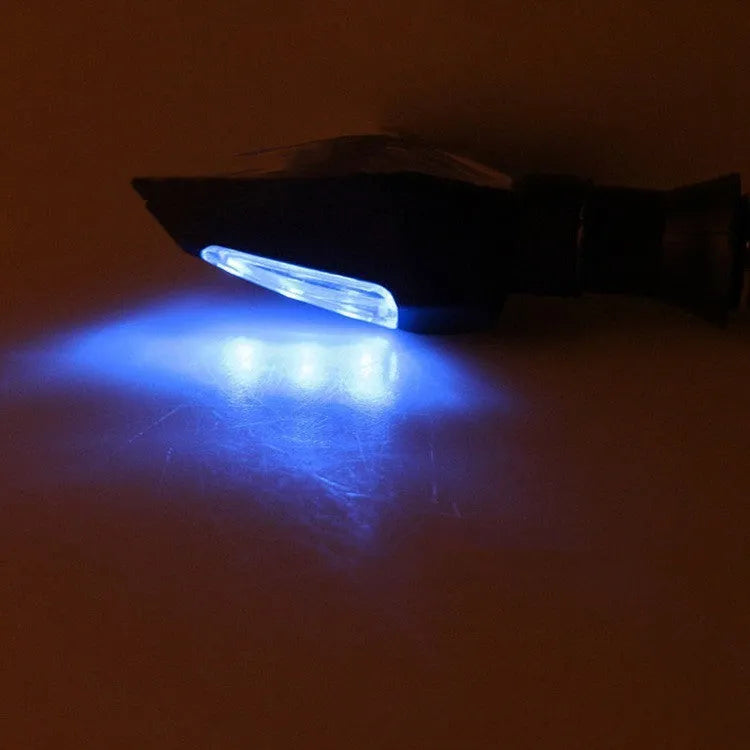 Motorcycle modified turn signal light with double-sided luminous function and yellow/blue light options
