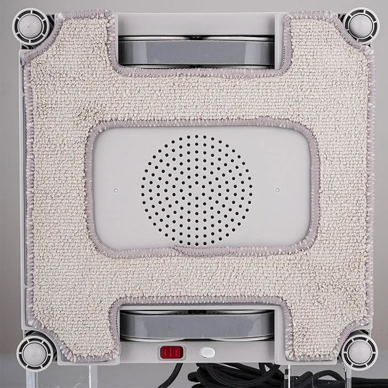 White intelligent window cleaning robot for automated washing of high-rise windows.