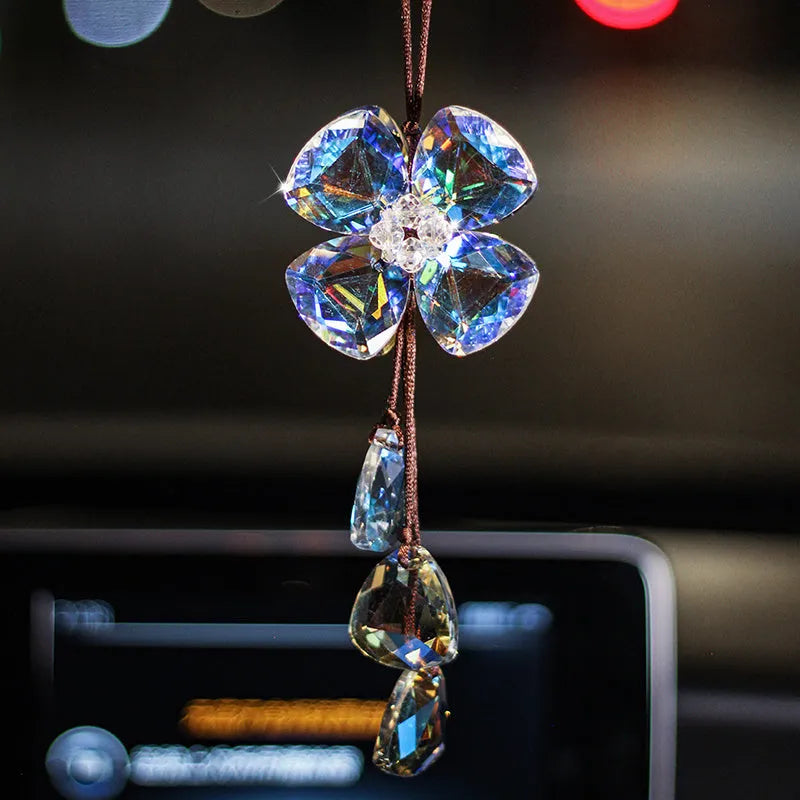 Crystal Four Leaf Grass car interior hanging pendant approximately 20cm long on a clear background.