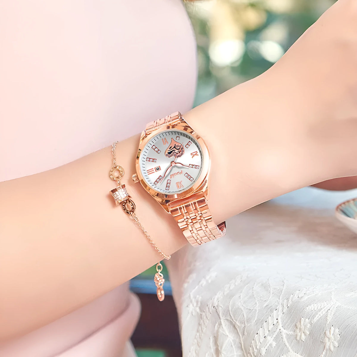 Women's fashion casual waterproof calendar luminous watch with alloy strap and Roman numeral rhinestone dial on white background