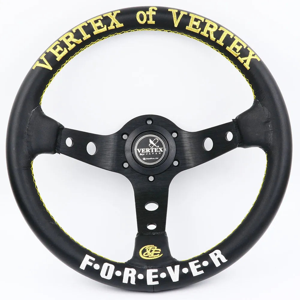 Black alloy racing steering wheel with deep concave rim and star embroidery pattern.