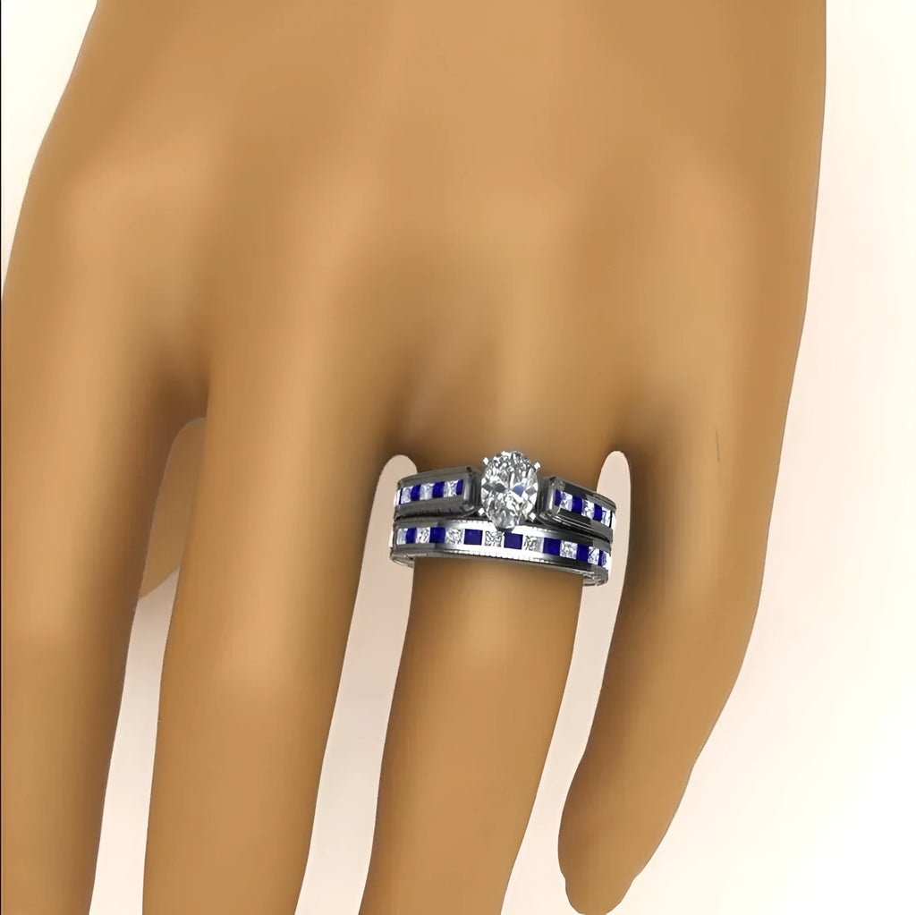 Blue alloy couple ring set with white diamond-style detail on white background
