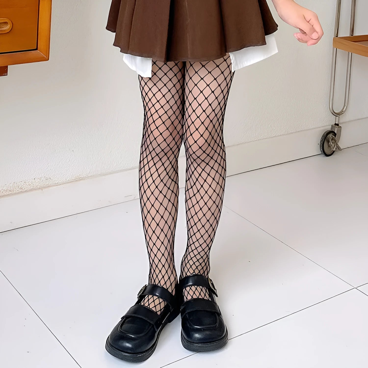 Women's mesh pattern pantyhose in black and white with large, medium, and small net designs