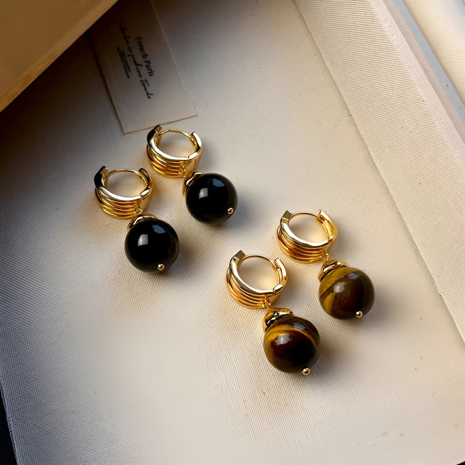 Gold-plated tigereye stone earrings with geometric round shape in French retro style