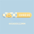 Cartoon cheese wrist rest mouse pad with keyboard holder placed on a wooden desk next to a notebook computer