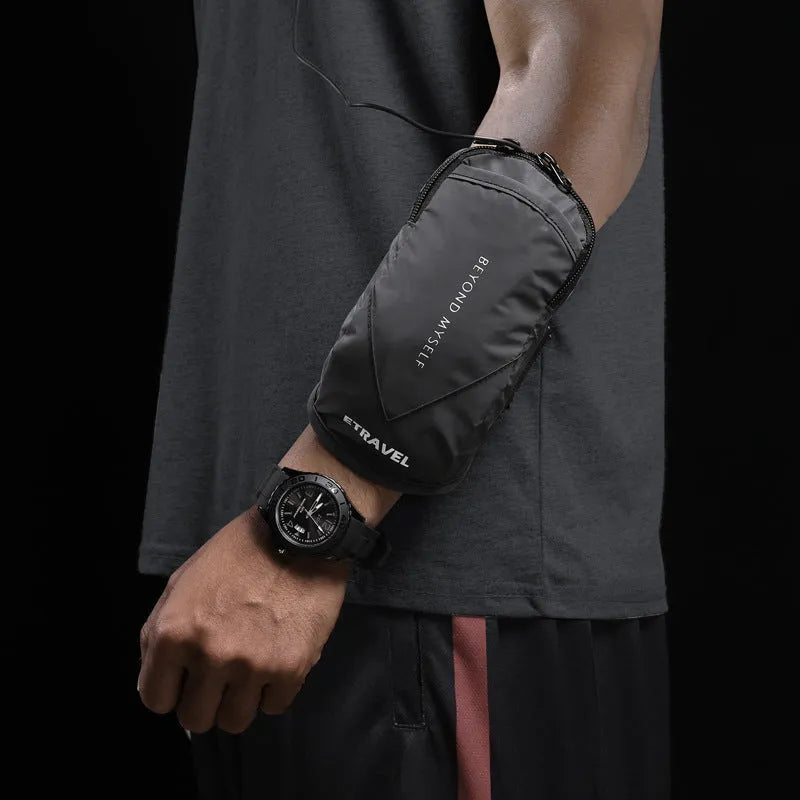 Black reflective running arm bag with adjustable strap, holding a mobile phone, shown on a runner's arm.