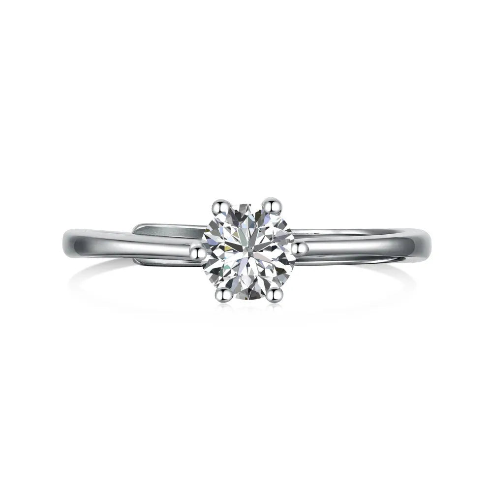 Sterling silver adjustable ring with round zircon in six-claw setting, open mouth band, geometric design
