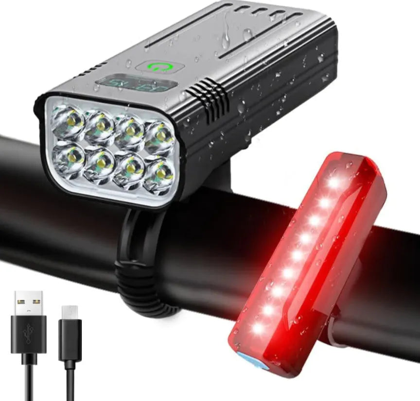 Black KX12DF digital display bicycle headlight with USB port mounted on bike handlebars