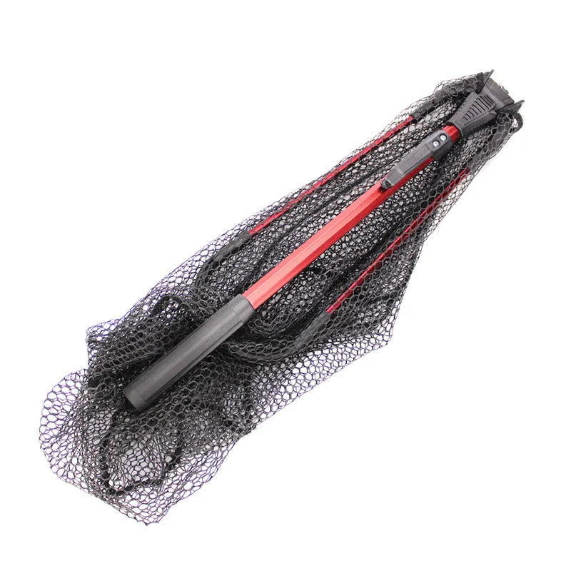 Red aluminium alloy single section triangular folding dip net collapsed to 47cm length, with viscose mesh, on a wooden table