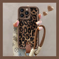 Brown leopard print silicone phone case for iPhone with an attached white lanyard strap.