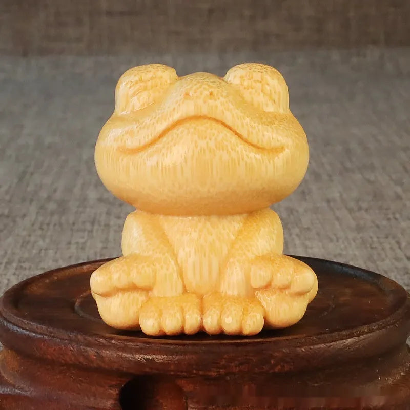 Solid bamboo carved smiling frog ornament with cartoon cute style, measuring 5cm high.