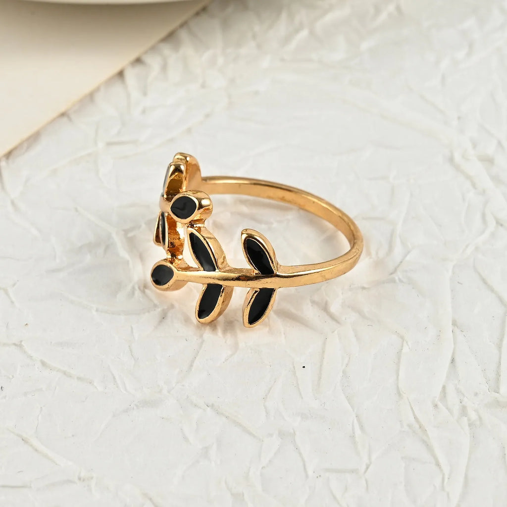 Gold electroplated acrylic fashion ring with geometric leaf design in floral shape for women